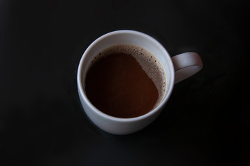 coffee with milk on black background
