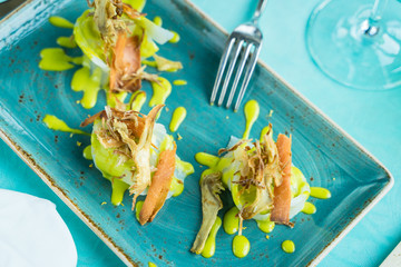 codfish carpaccio with fried artichoke and tuna bottarga
