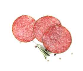 Slices of tasty sausage on white background, top view