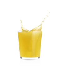 Juice splashing out of glass isolated on white