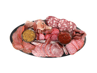 Slices of different sausages with sauce isolated on white, top view