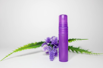 purple bottle parfume on white background