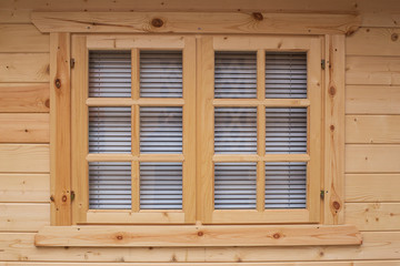 wooden window closed by blinds