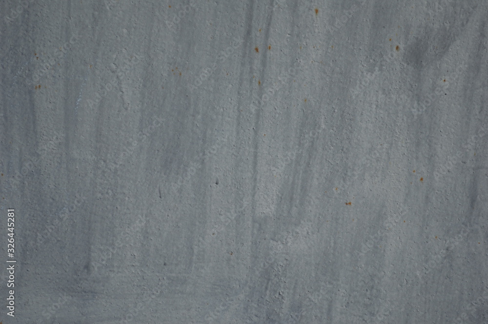 Poster paint texture. old gray background. rough surface with small rust spots. vintage grungy decoration. 