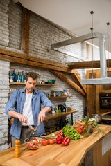 Young man preparing food in the kitchen