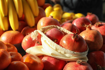 Cotton eco bag with fruits on pomegranates. Life without plastic