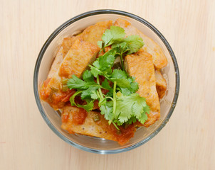 Delicious fried fishcakes bowl on top view