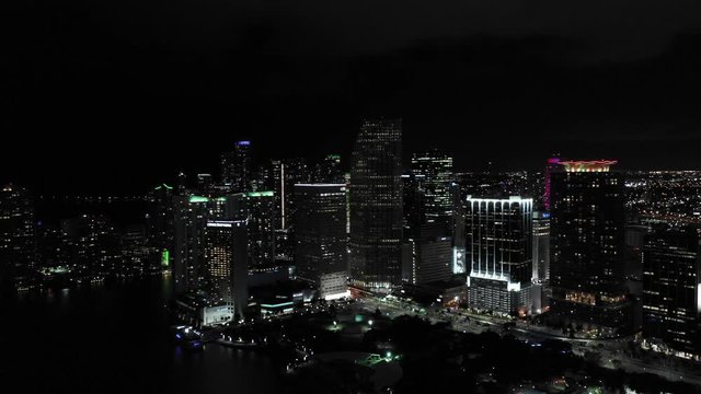 Sweeping shot Downtown Miami aerial night 4k