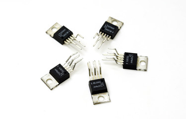 Various electronic components,  transistors close-up on white background.