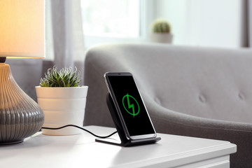 Smartphone charging on wireless pad in room
