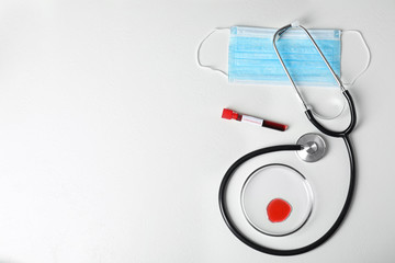 Flat lay composition with blood samples on white background, space for text. Corona virus research