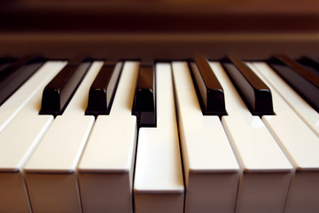 Detail of a piano keyboard with one key (b) pressed