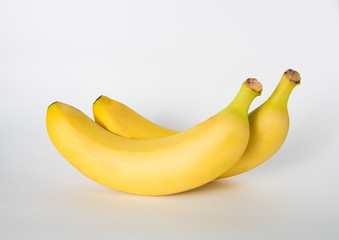 two bananas on a white background