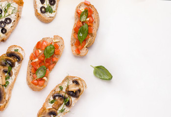 different types of bruschetta sandwich on a white background. copy space
