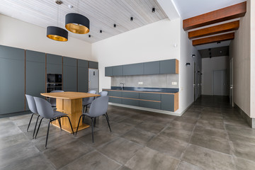 The dining room and kitchen are Scandinavian-style. Spacious. Dining table.