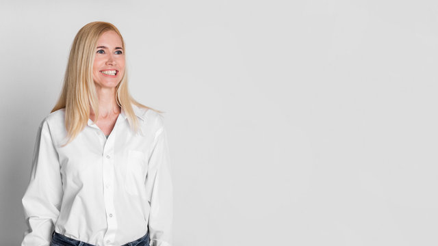 Confident mature businesswoman looking away at copy space