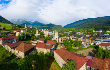 Fototapeta na wymiar Panoramic view of Svan Towers in Mestia, Svaneti region, Georgia. It is a highland townlet in the northwest of Georgia, at an elevation of 1500 meters in the Caucasus Mountains.