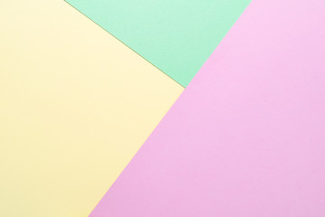 Green, purple and beige pastel color abstract geometric paper background.