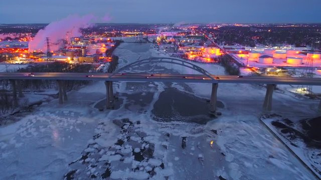 Scenic highway bridge predawn, dynamic aerial view with city lights and traffic. This is the Leo Frigo Memorial Bridge, Green Bay, Wisconsin.