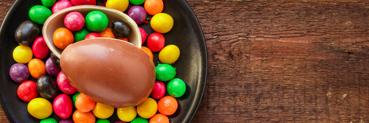 chocolate egg and candy easter decor, menu concept background. top view. copy space