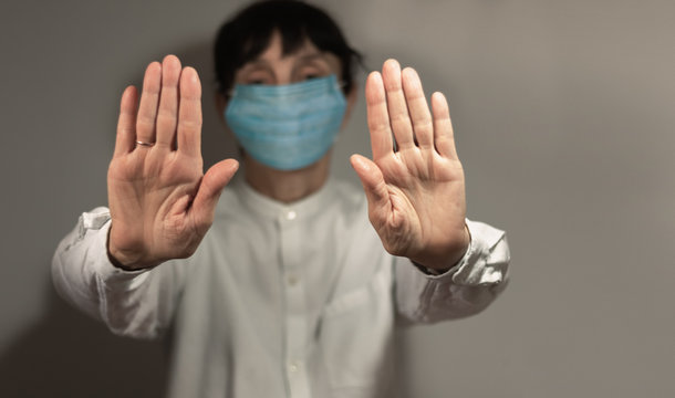 Stop coronavirus, quarantine and Air pollution pm2.5 concept. Old sick woman wearing respirator mask for protect. Wuhan, China epidemic virus symptoms background