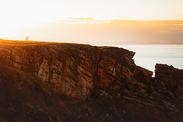 Information board on the edge of a cliff in Basque Country coast