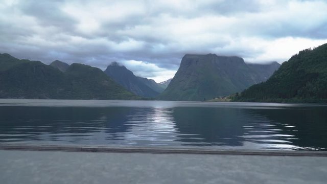 Dark clouds covering beautiful fjord in norway - norwegian coast
