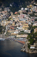 Fototapeta na wymiar Positano. View from above of the large beach and the village that climbs the hill