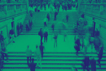 Overhead view of crowds of people on steps in Central Park New York City with green and blue color effect