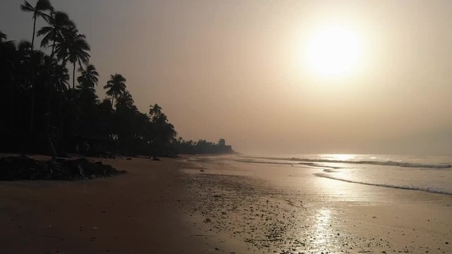 Drone shot through the rock formation of the coastline from an afro&iexcl;ican beach named Krocobite located in Accra, Ghana.