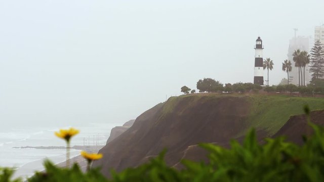 Beautiful footage of cliffside by the ocean in Lima, Peru during a cloudy day.