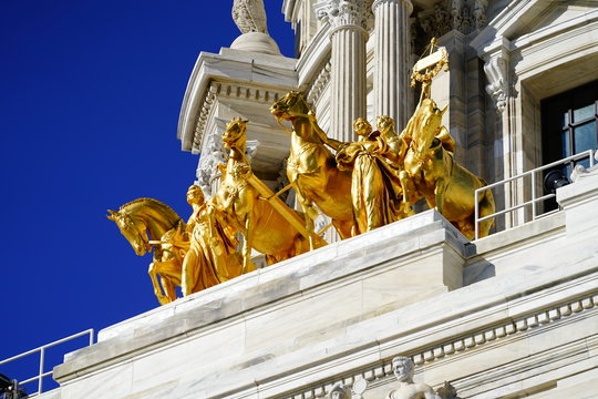 The Quadriga progress of the state. Golden statues to top of Minnesota state Capitol building.