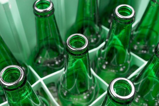 Empty Green Glass Beer Bottles In The Plastic Box