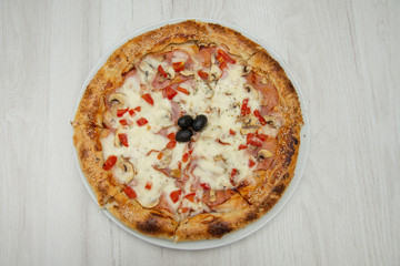 pizza with peppers and mushrooms, sesame and olives