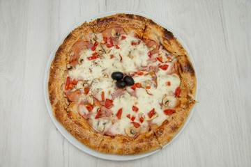 pizza with peppers and mushrooms, sesame and olives