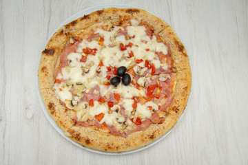pizza with peppers and mushrooms, sesame and olives