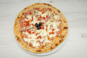 pizza with peppers and mushrooms, sesame and olives