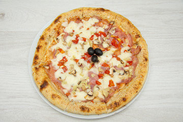 pizza with peppers and mushrooms, sesame and olives