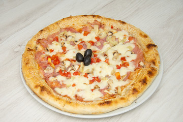 pizza with peppers and mushrooms, sesame and olives