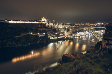 Fototapeta na wymiar Night View of Luis I Bridge Crossing Douro River in Porto, Portugal