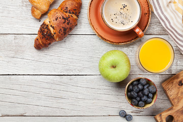 Breakfast with coffee and croissant
