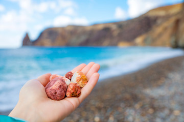 Hands holding stones. 