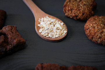 spoon with spices on wooden background