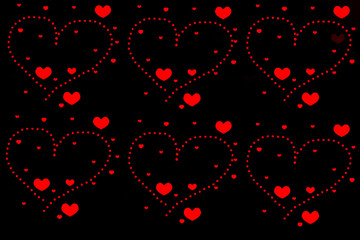 Fototapeta na wymiar Rote Herzen auf schwarzem Hintergrund