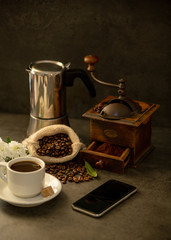coffee grinder and cup of coffee