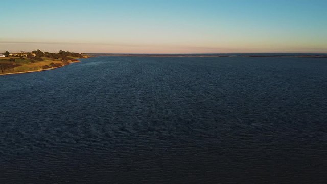 Aerial images from the sea to the coastline at l'&eacute;tang de Vic at sunset, Vic la Gardiole, Languedoc-Roussillon, France, Europe.