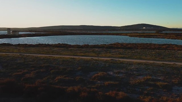 Drone view point of the coastline in the &eacute;tang de Vic pond at sunset, Vic la Gardiole, Languedoc-Roussillon, France, Europe.