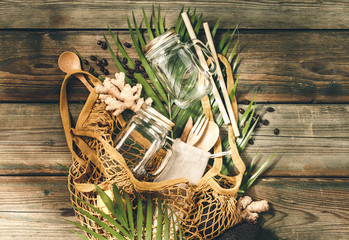 Zero waste, shopping or travel concept. Textile eco bags, glass jars and eco friendly products on...