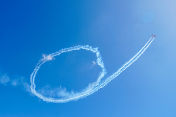 Plane doing acrobatic formation in the blue sky. Airplanes on airshow. California 