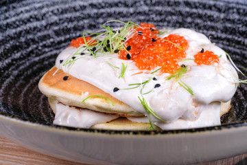 pancakes with caviar and sauce 